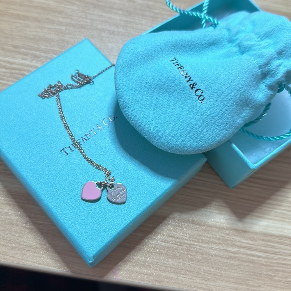 Authentic mini double heart tag pendant.